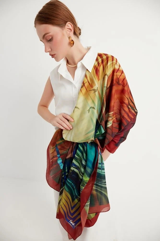 Bosphorus scarf from Istanbul Collection reimagines the beauty of Istanbul with the iconic Galata Tower and mesmerizing city skyline, with soothing shades of red, gold, blue, and green. A wearable piece of art with contemporary and fractal patterns.